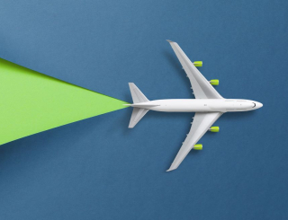 aircraft over blue and green background